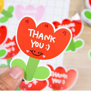 [gallery] Red flower thank-you card held in hand