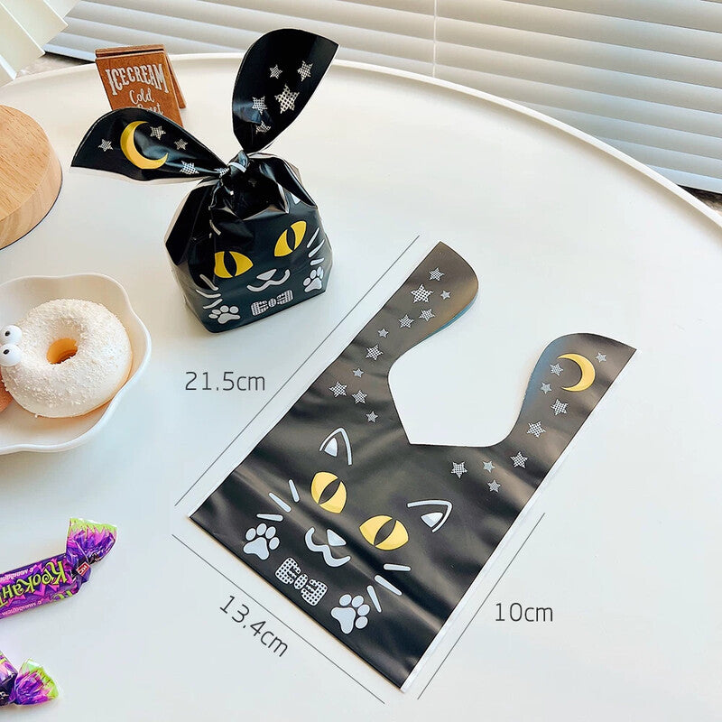 Black cat bunny-ear treat bag with moon and star design