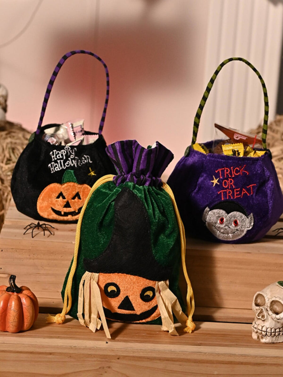 [gallery] Halloween plush candy bags on a wooden shelf with skeleton decor