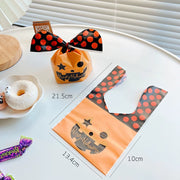 [variant] Pumpkin bunny-ear treat bag with orange polka-dot design