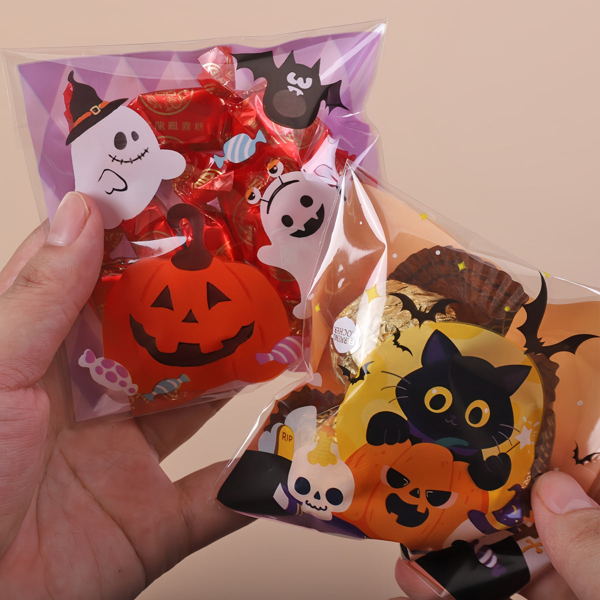 Halloween treat bags filled with candy — ghost pumpkin and cat prints