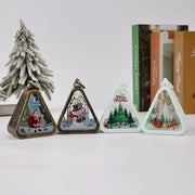 [gallery] Christmas retro LED lanterns — group of lit triangle ornaments with a tree backdrop