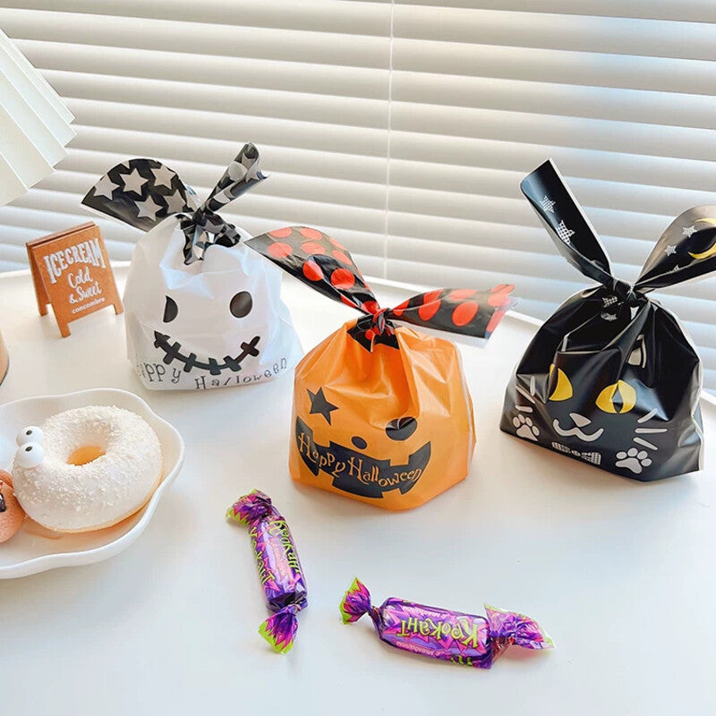 Mix of ghost, black cat, and pumpkin bunny-ear treat bags