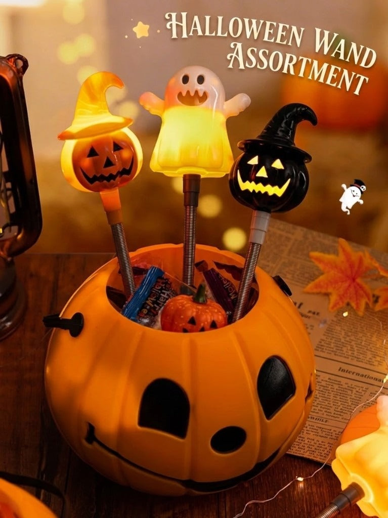 Halloween wand assortment — orange-hat, ghost, and black-hat in a pumpkin bucket