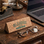 [gallery] Glasses Club cork foldable glasses case on a desk with eyeglasses